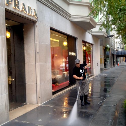 Power washing of city sidewalks for cleaning and g