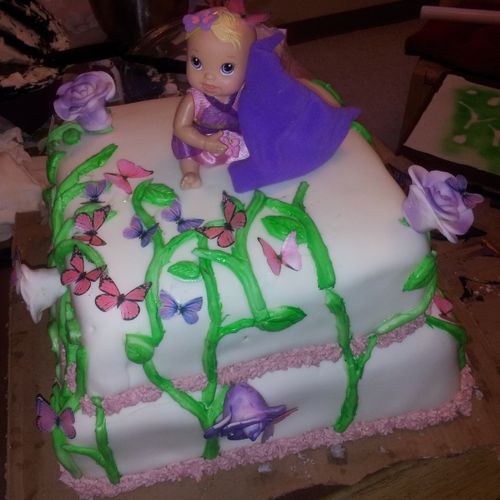 Here's a beautiful baby shower cake. With edible b