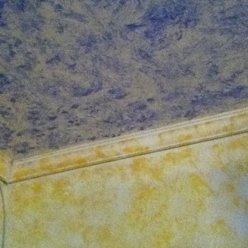 a ceiling and wall detail. Hand rolled paint with 