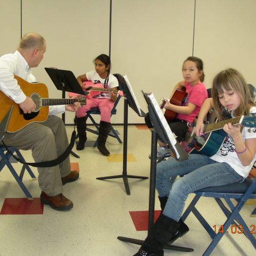 Group guitar lesson at Symmes Elementary.