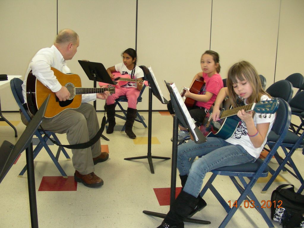 Group guitar lesson at Symmes Elementary.