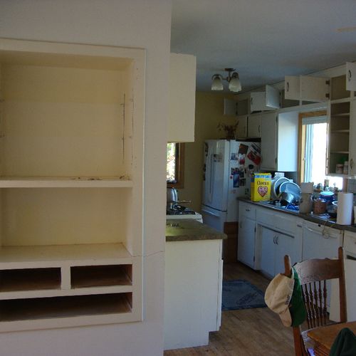 Before--old cupboards and laminate countertops