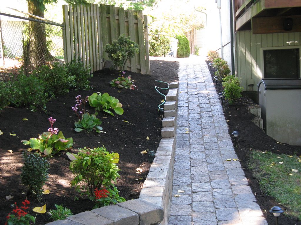 Pathway, retaining wall and plants completely inst