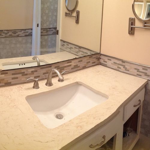 Tiled, painted, and replaced the vanity in this cl