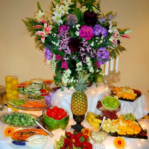Fruit display with flower arrangement