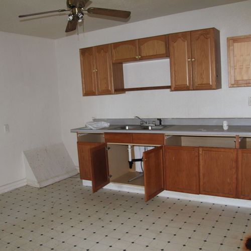 Before: This sad kitchen was a hodge podge of cabi