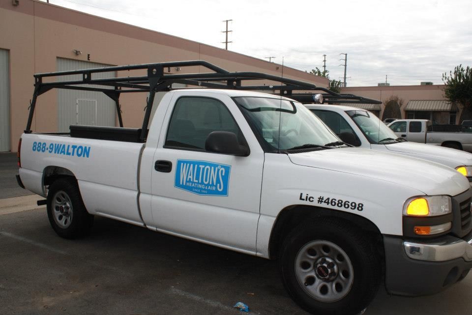Walton's Heating and Air company trucks.
