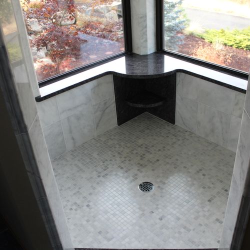 Shower with granite bench and shelves