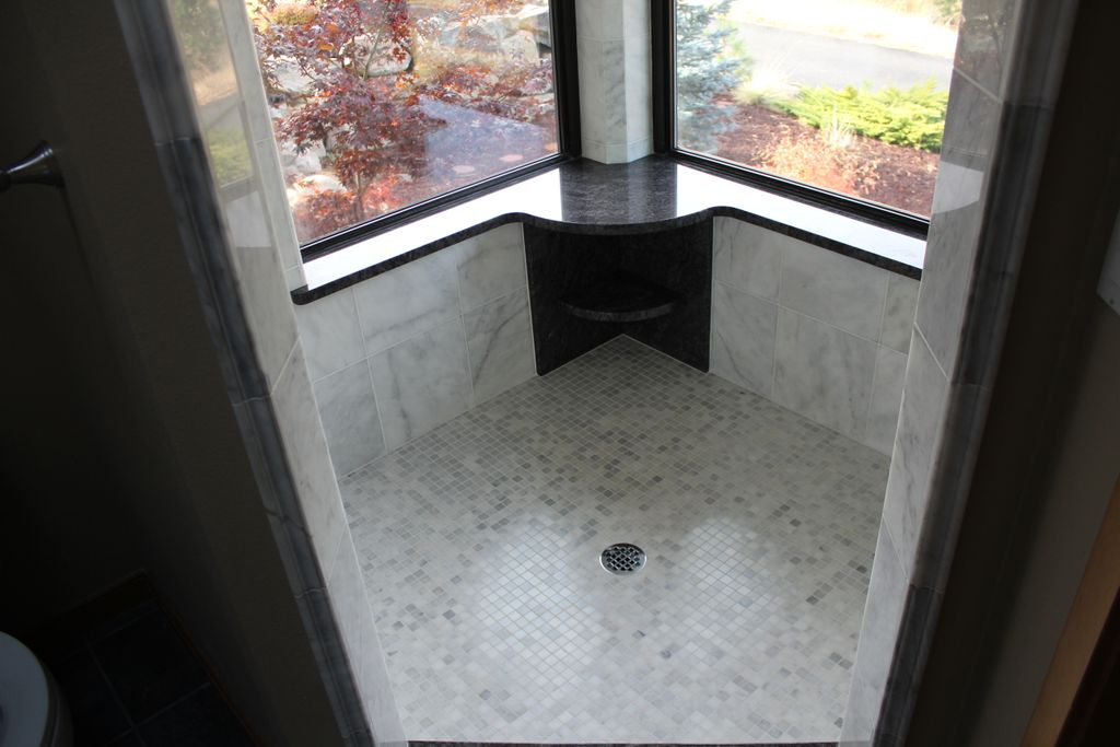 Shower with granite bench and shelves