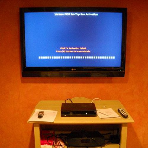 Gaming system installed with flat screen mounted o