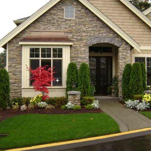 Cultured stone with copper roof entry trim pieces