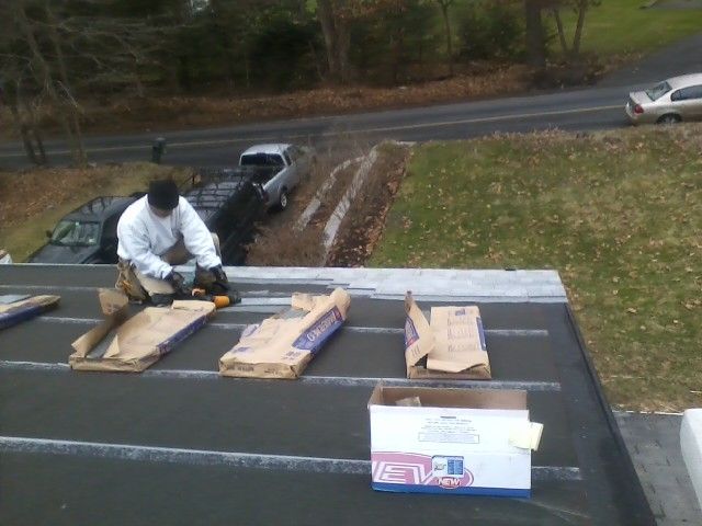 Starting to lay new shingles on upper roof