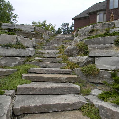 Boulder slab steps in the backyard of a Clarkston 