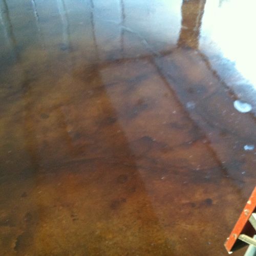 Acid stained garage floor with sealer.