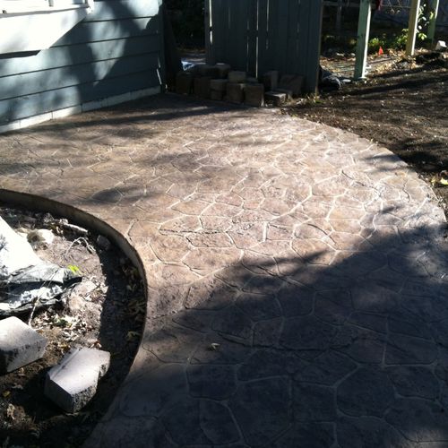 Old Granite stamped patio with varying browns colo