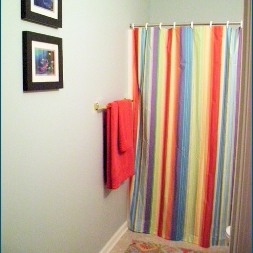 Pairing a bright and colorful shower curtain with 