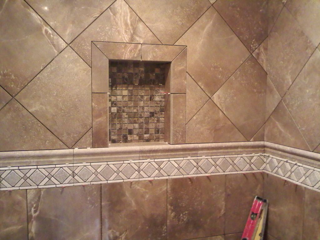 Custom porcelain and travertine tile walk-in showe