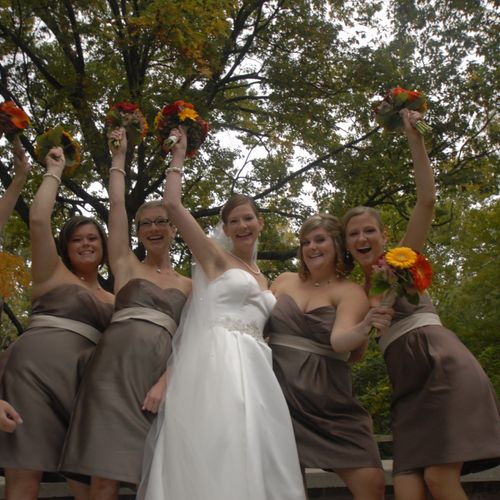 The bride and her bridesmaids celebrate.