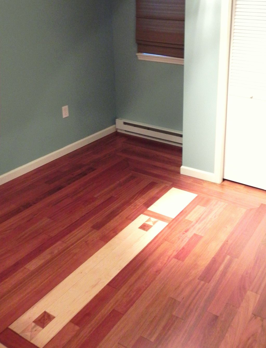Brazilian cherry install with maple inset.
