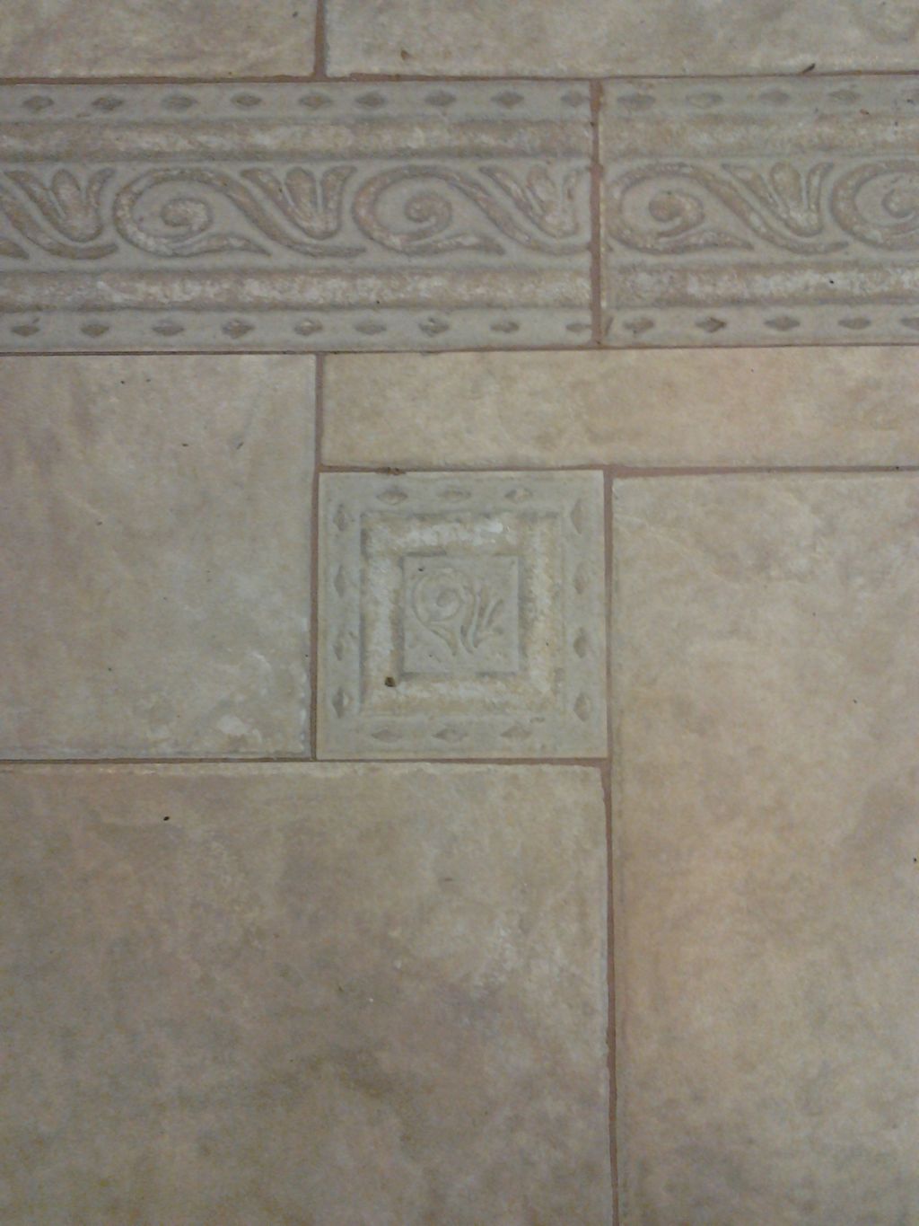 See how dirty the grout lines are.