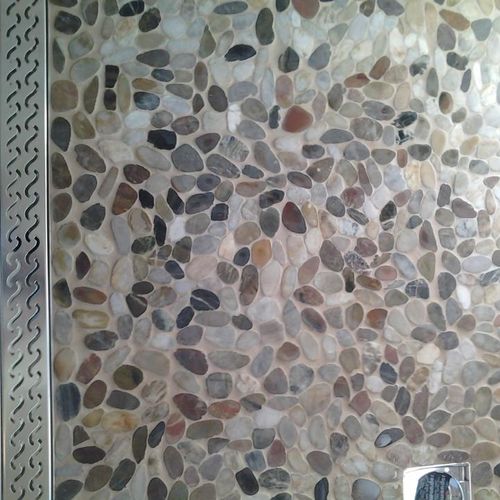Pebble rock shower floor with french drain ADA sho
