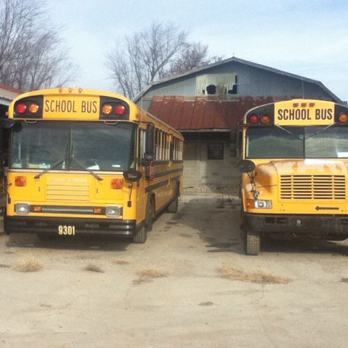 Two of our standard school buses. 55 adult passeng
