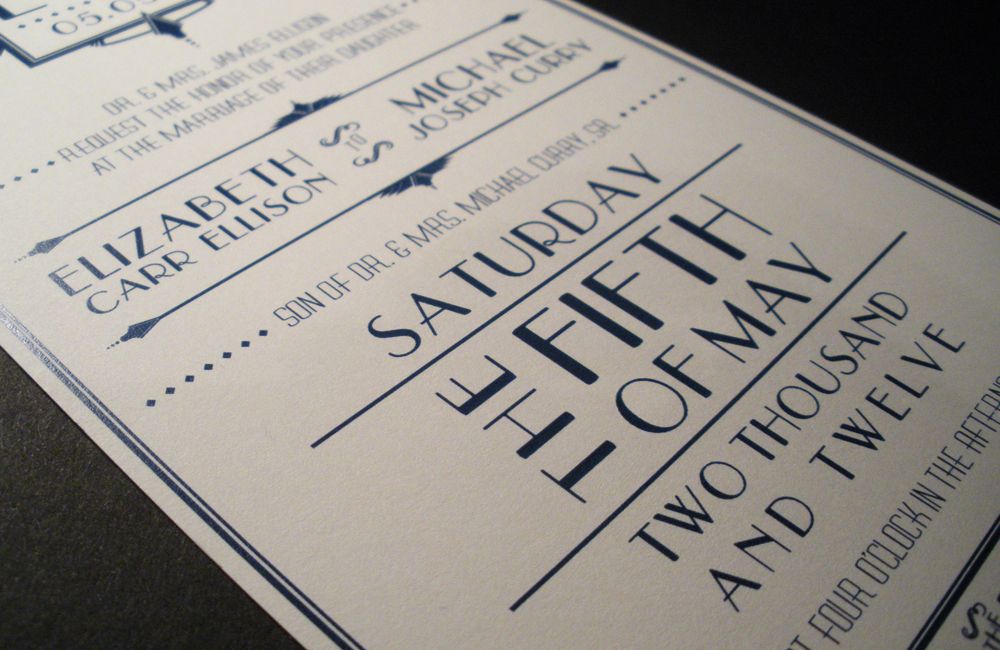 Close up of art deco wedding invitation.