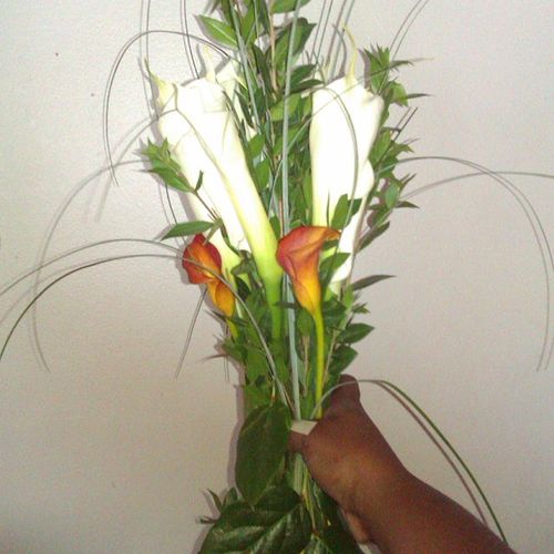 Mini roses & Calla Lilies $45.00 and up.