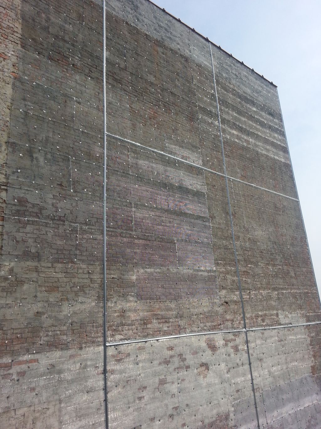 Wall Stucco wire mesh installation work.
