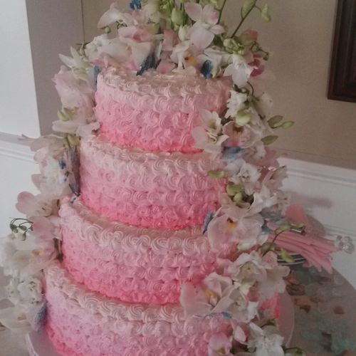 Buttercream Wedding cake with fresh flowers.