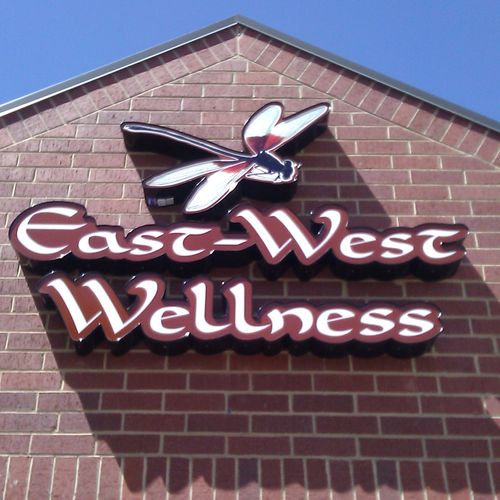 Our East-West Wellness logo on a sunny day!