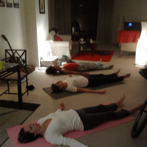 Happy, peaceful clients at in-home yoga session