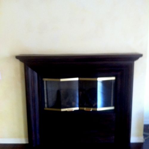 Faux wall paint and oil stained fireplace.  Origin