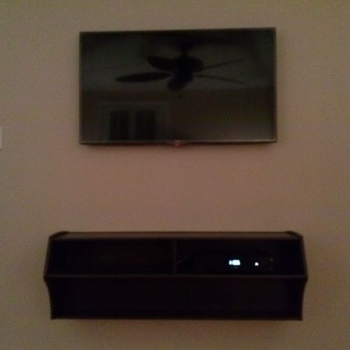 TV Mounted with Floating Entertainment Shelving