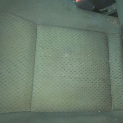 Cloth car seat burn repaired.