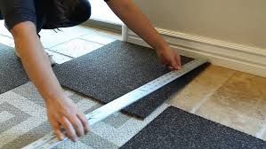 installing carpet tile in a customers home these a