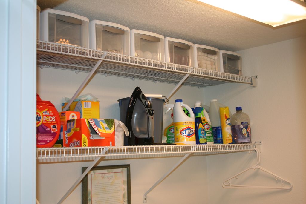 Reconfigure shelving above washer and dryer to max