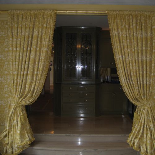 Custom upholstered walls and portiers.