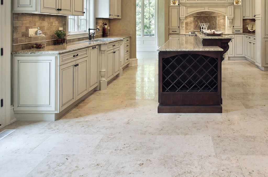 Floor is polished stone installed in offset brick 