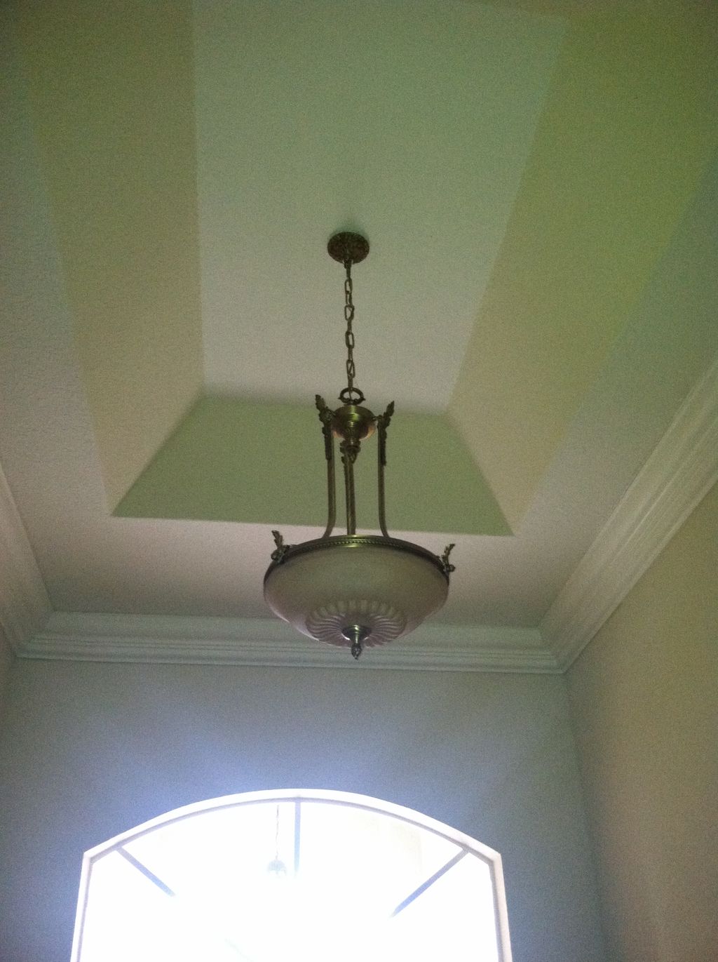 Chandalier installed in entryway.