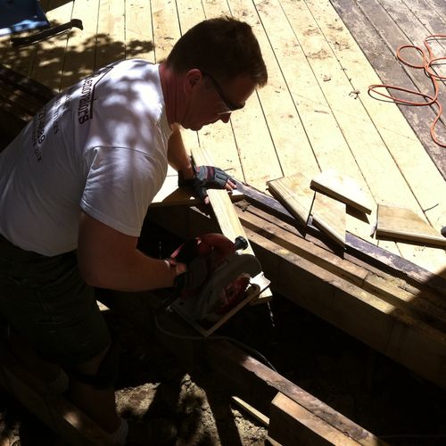 Handyman services repairing rotted deck also rotte