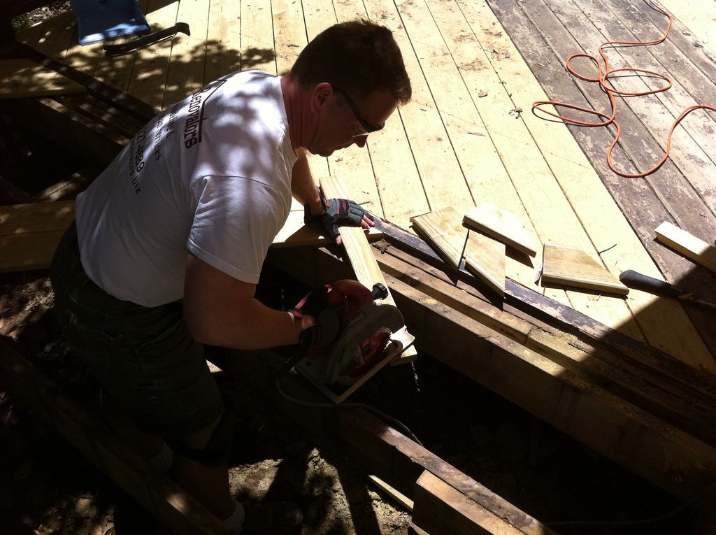 Handyman services repairing rotted deck also rotte