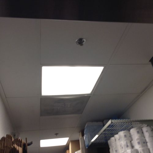 Installed vinyl ceiling tiles, grid, and lighting 