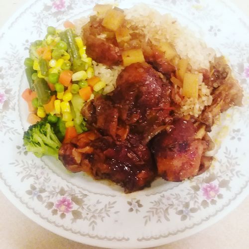 Brown stew chicken brown rice broccoli and mix veg