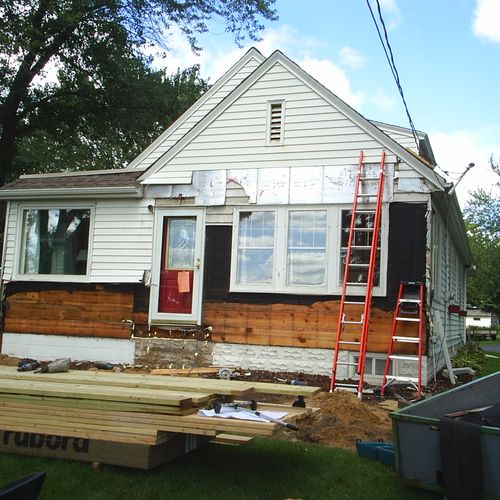 Starting porch,windows & siding