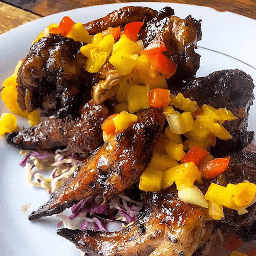 grilled sweet honey wings with a mango red pepper 