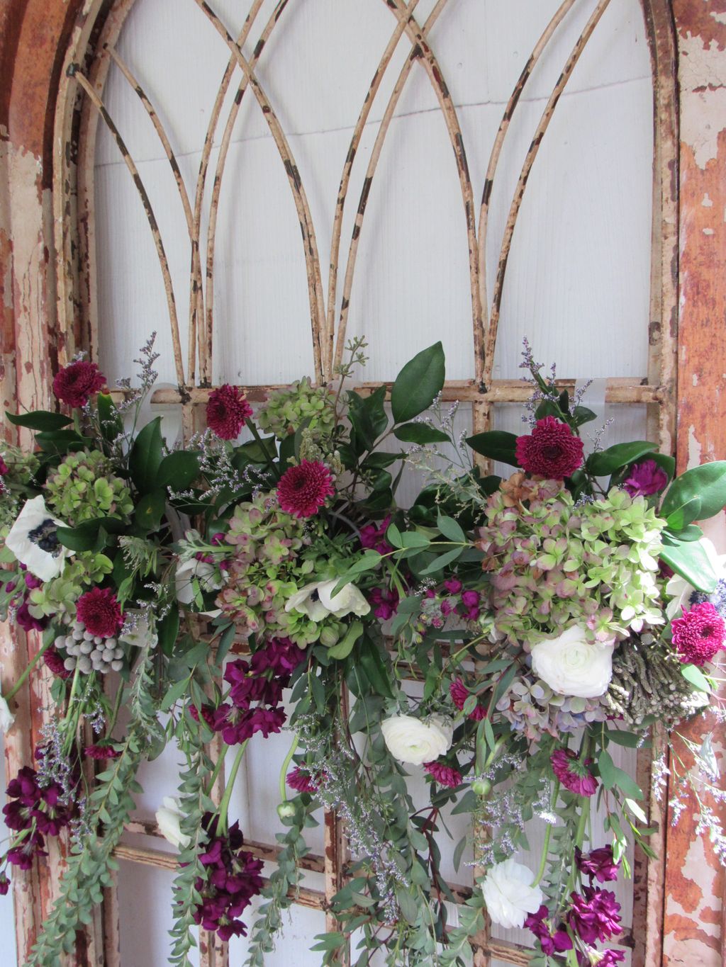 Karen adorned a rustic window pain with flowers to