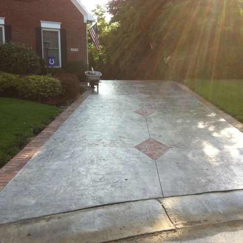 stamped driveway with real brick border