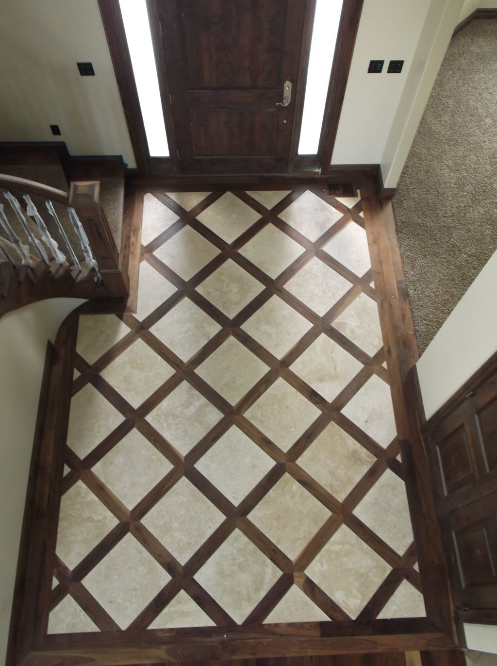 Walnut flooring with travertine inlay