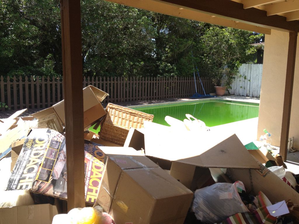 Before cleaning up a large pile of trash. La Cresc
